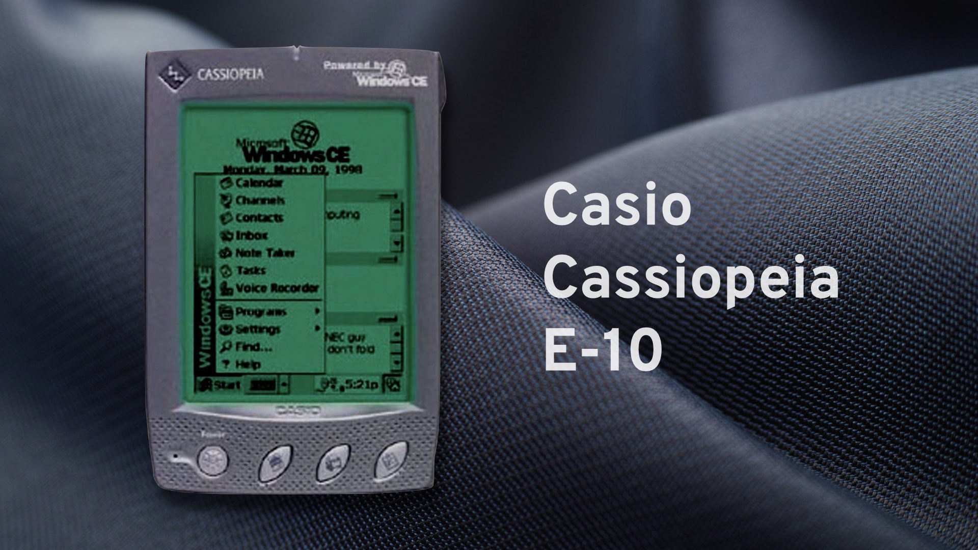 A Casio Cassiopeia E-10 sitting on a table, showing a Start menu